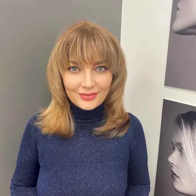 Feathered Shaggy Cut with low-maintenance Fringe