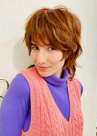 Short shag with bangs and longer in the back