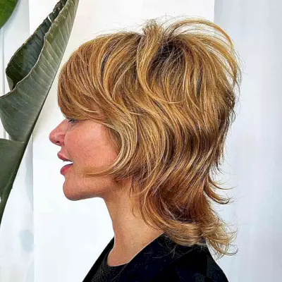 Textured Shag Mullet for women with shoulder-length hair and thick tresses