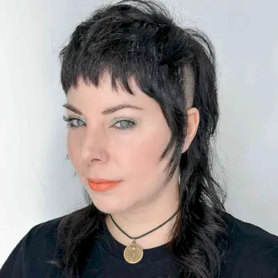 Punk Rock-Inspired Shag Mullet with a Shaved Side 