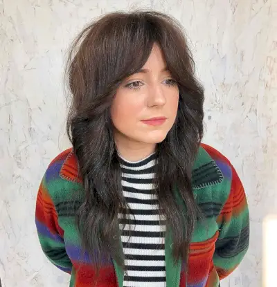 Glossy long shag haircut with curtain bangs