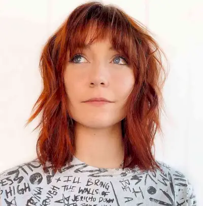 Shoulder-length red shag haircut