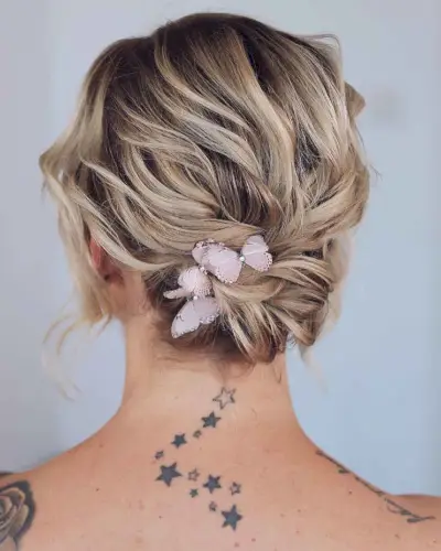 Feathered updo for short bob