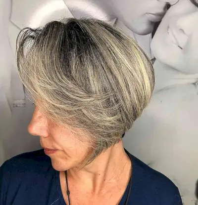 Jaw-Length Rooted Blonde Bob with Long Side Bangs and Stacked Layers for Older Women Past 60