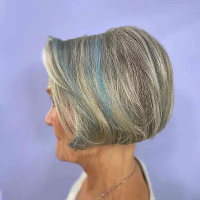 Short Salt-and-Pepper Bob with Blue Accents for Modern Ladies Aged 60