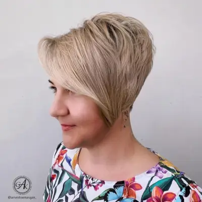 Stacked pixie with long side bangs