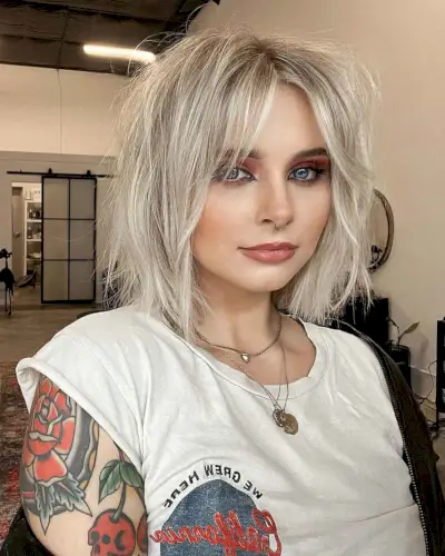 Messy Layered Cut with a Soft Curtain Fringe