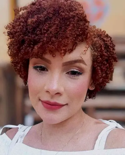Short curly hair with side bangs