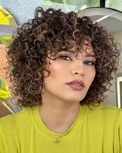 Short Light Curls with Highlights and Bangs
