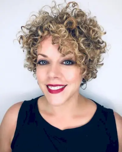 short curly hair with side swept bangs