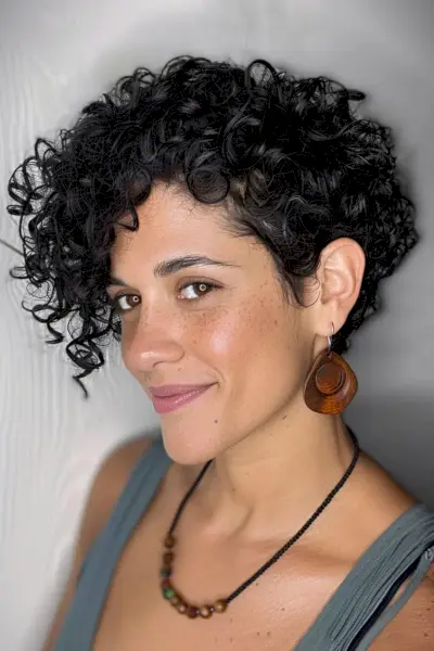curly pixie bob with long curly bangs