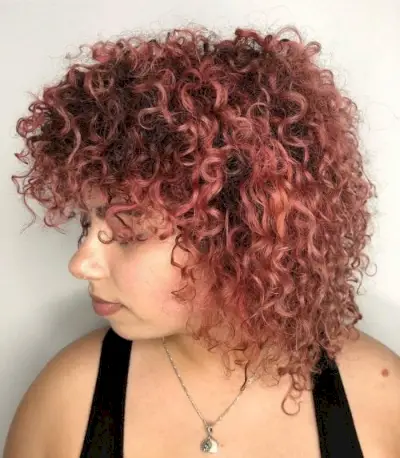 Short curly hair with bangs and layers