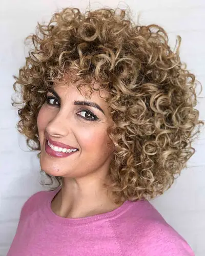 Short Loose Blonde Curly Hairstyle with Bangs