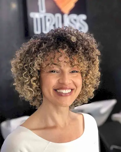 Perfectly Shaped Curly Bob with Fringe and highlights