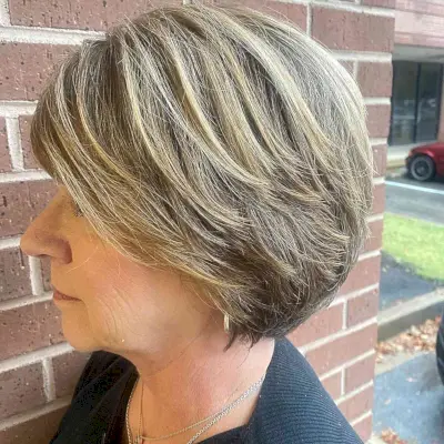 Chin-Length Choppy Round Bob with Shorter Layers and Side Bangs for Ladies over 60