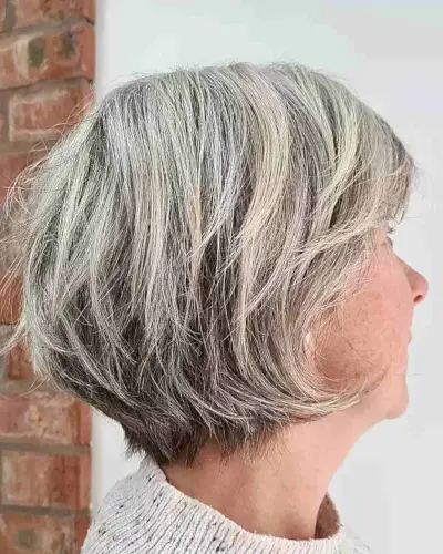 Soft Textured Choppy Bixie with White Blonde Highlights on Ladies Over 60-Years-Old
