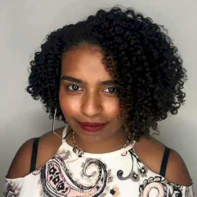 Fashionable asymmetrical short, curly bob