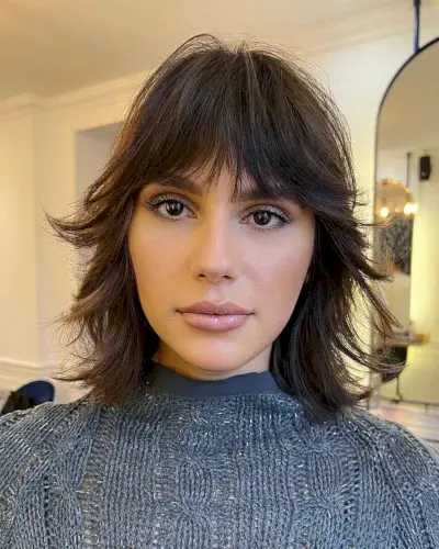 Wolf Haircut with Eyebrow-Length Bangs