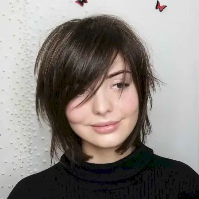 Layered Wolf Haircut with Side-Swept Bangs