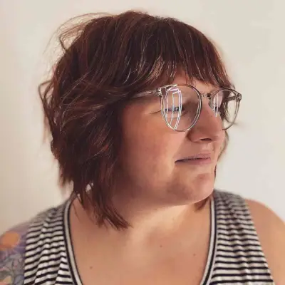 Graduated and Layered Shaggy Bob with Bangs for a Chubby Face