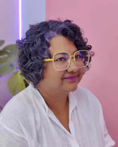 Side Part Curly Bob with Violet Highlights for Chubby Face Shapes