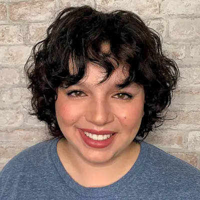 Deva Cut-Inspired Curly Short Hair for Round Face Shapes with choppy bangs