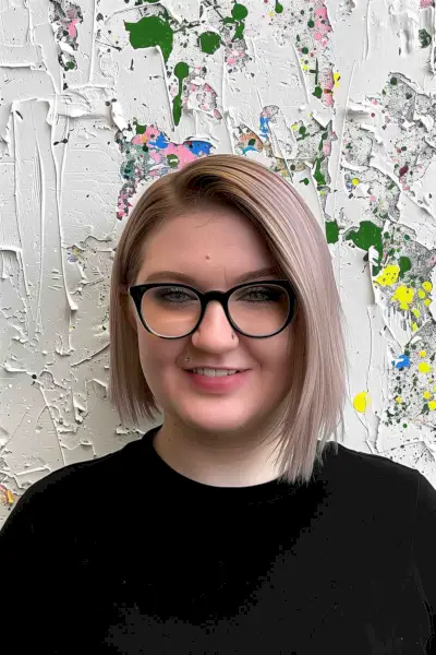 Sleek platinum blonde blunt bob haircut for woman with round face