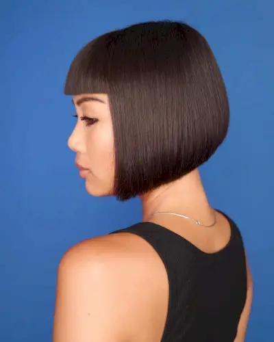 Stylish short haircut with blunt bangs for asian girl