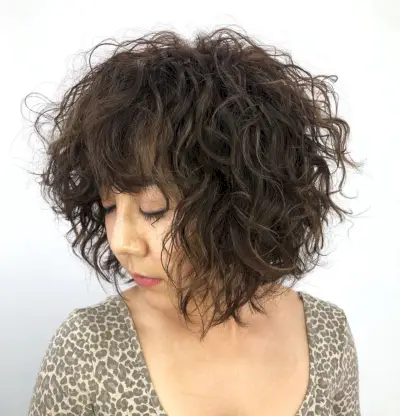 messy short curly bob haircut for asian girl
