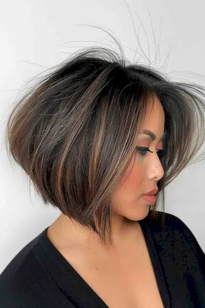 Stylish woman with dramatic highlighted angled bob hairstyle