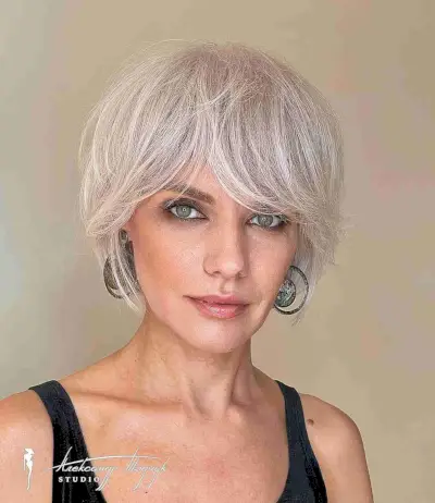 Jaw-Length Feathered Bob and Bangs for Women Over 40