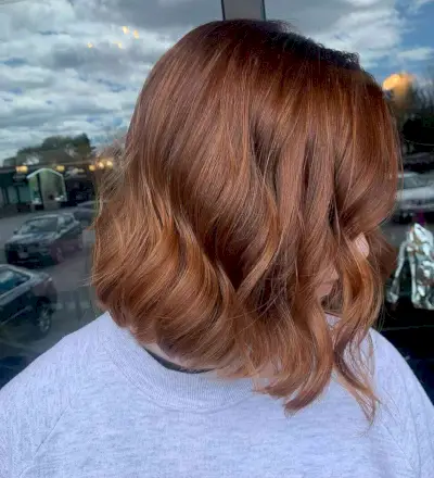 Short Wavy Hair with an Auburn Chestnut Hue