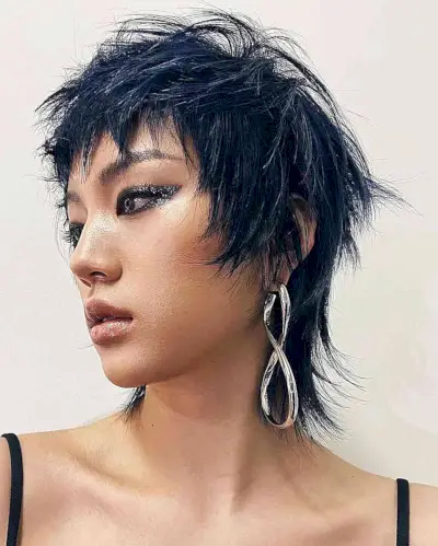 Short-Length Mullet with Messy Layers and Choppy Bangs for Long Faces