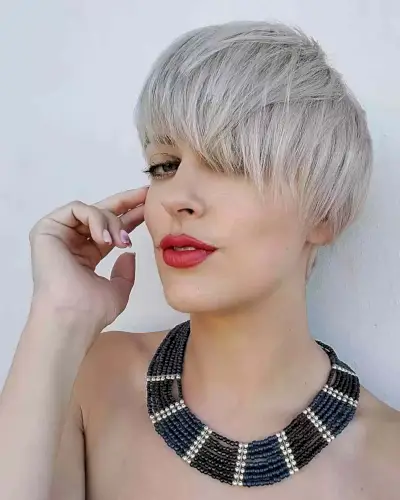 Platinum Pixie with Asymmetrical Bangs and Choppy Layers for Oval Faces