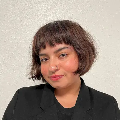 Mini Bob with Jagged Bangs and Subtle Layers for Round Face Shapes