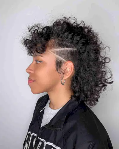 Undercut Mid-Length Curly Mohawk with Buzzed Lines