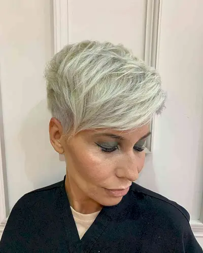 Platinum Pixie with an Undercut and Sweeping Bangs for women with long faces
