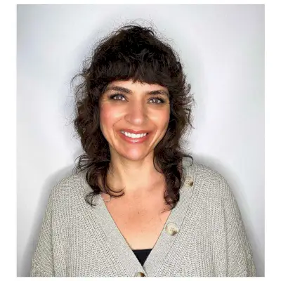 Medium-Length Shag with Bangs for Wavy to Curly Hair