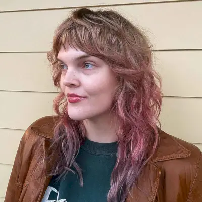 Messy Shag Cut with Bangs for Wavy Hair