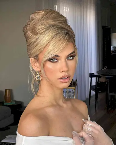 Beehive-Inspired Updo for Weddings and for women with long blonde hair