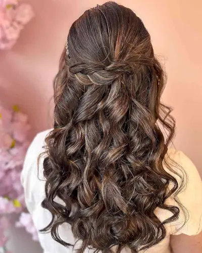 Long Braided Half Up with Voluminous Waves as wedding guest hairstyle