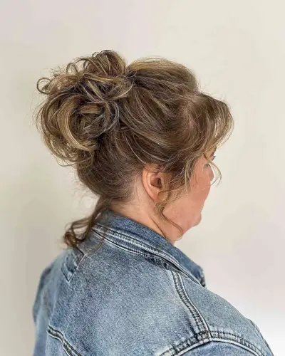 Face-Framing High Loose Knot Hairstyle for Older Wedding Guests