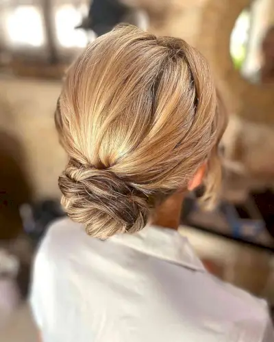 Blonde Twisted Low Bun Wedding Guest Hairstyle