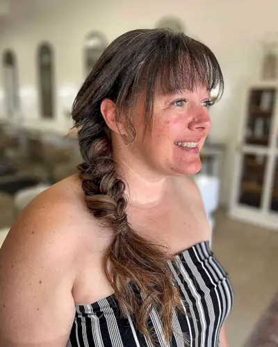 Medium Side-Swept Braided Style with Bangs for Wedding Guests