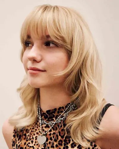 Soft Blonde Wolf Cut with Bangs for women with mid-length hair