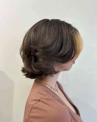 Short Wolf Butterfly Cut on Thick Dark Hair with Money Piece