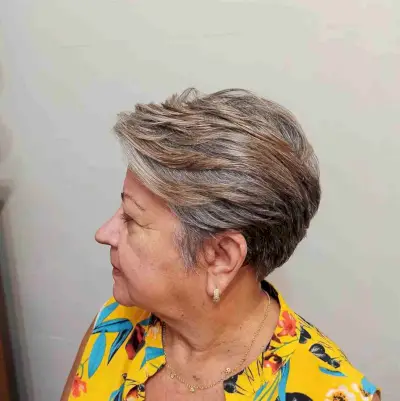 Casual Short Graduated Pixie Haircut with Highlights for a 60-Year-Old