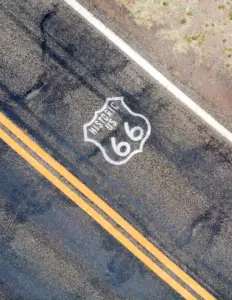 Route 66 painted on the two-lane highway asphalt